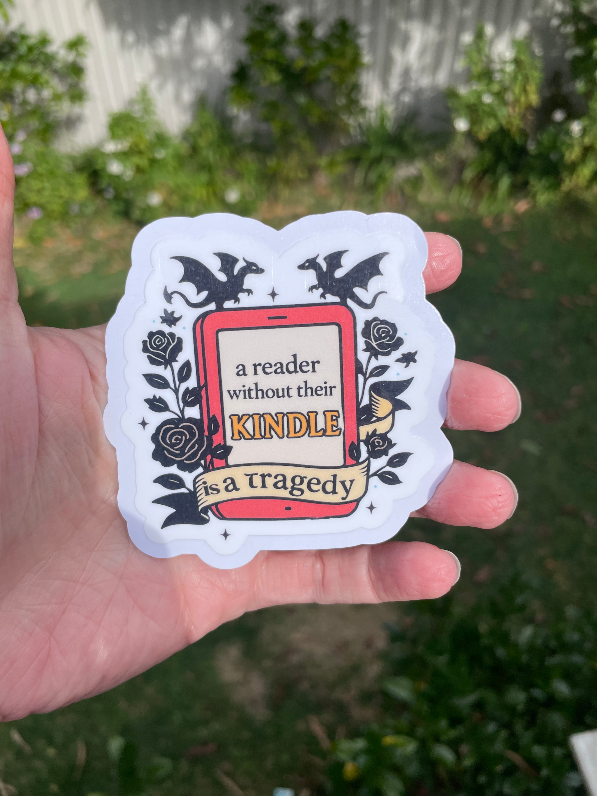 A Reader Without Their Kindle is a Tragedy Die Cut Sticker